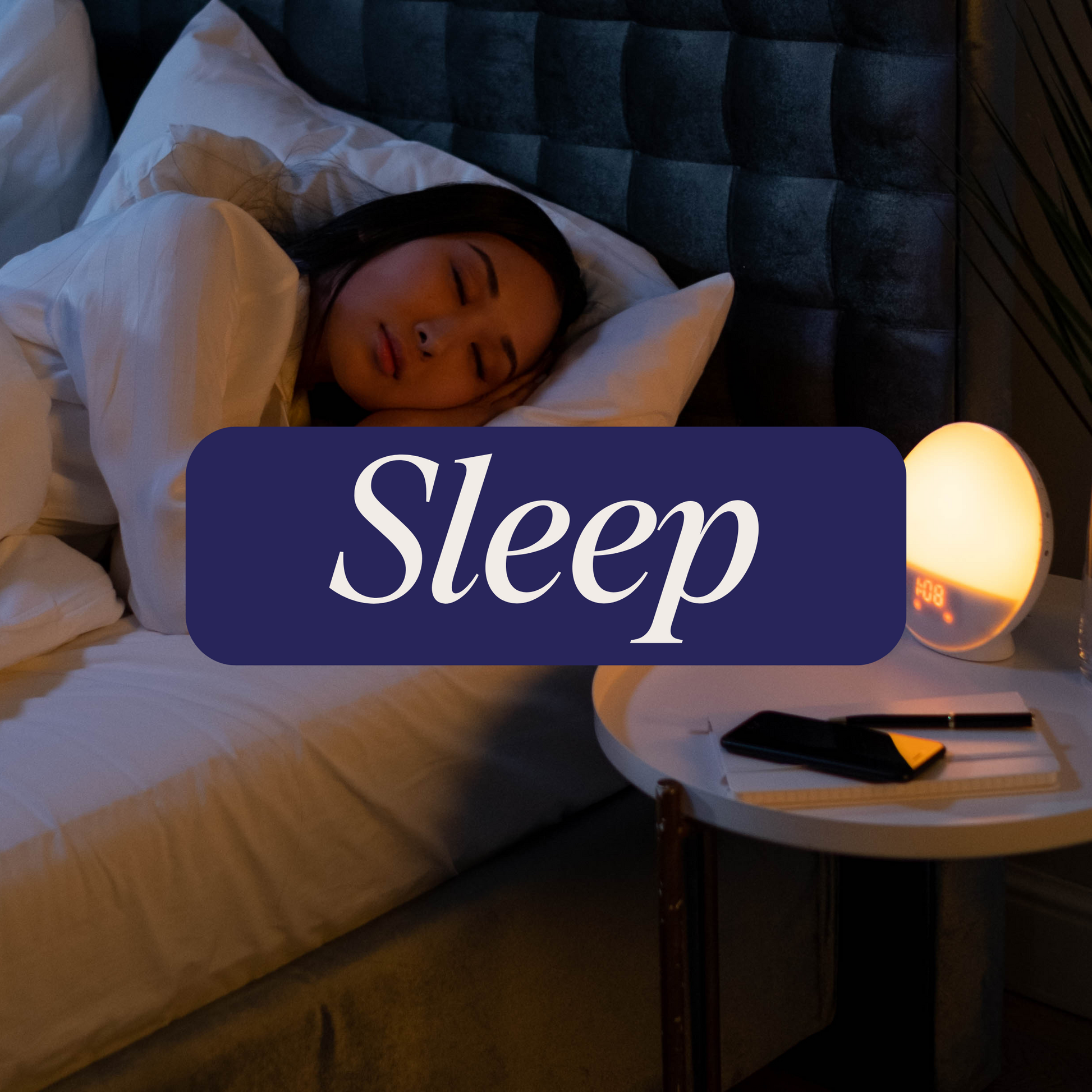 Person sleeping with a dark purple banner that says 'Sleep' in white lettering.