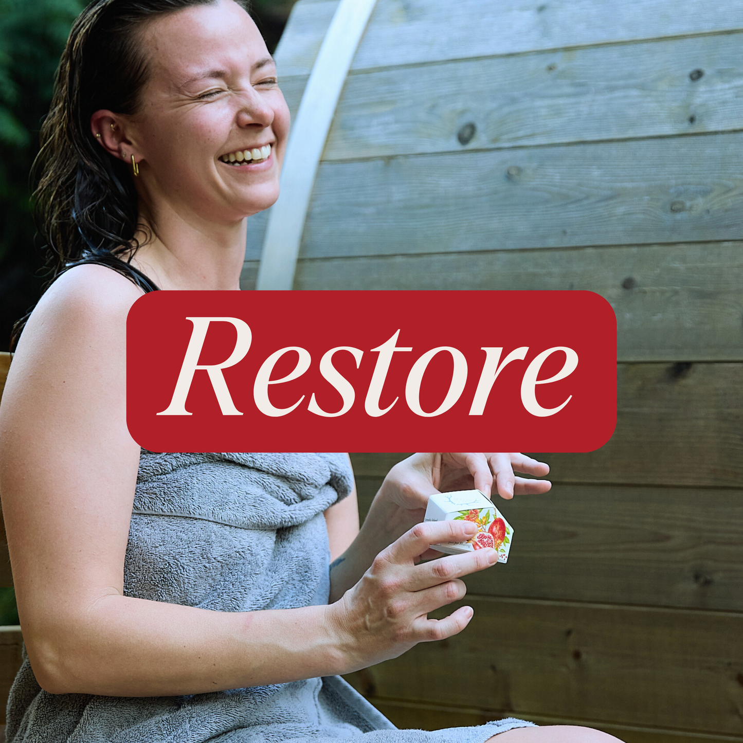 Person at a spa with a box of Wyld gummies in their hands. Red banner with the word 'Restore' in white lettering.