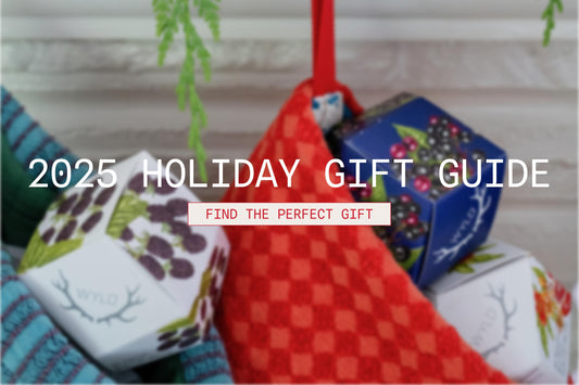 Holiday gift guide banner featuring Wyld Hemp gummy boxes in festive stockings, with text overlay reading ‘2025 Holiday Gift Guide’ and ‘Find the Perfect Gift.’ Bright, colorful packaging and cozy holiday décor create a cheerful seasonal vibe.