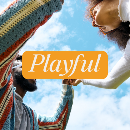 Two people interacting under a bright blue sky, one in a colorful striped sweater and the other in white clothing, with the word 'Playful' centered on an orange banner—evoking a joyful, lighthearted vibe.